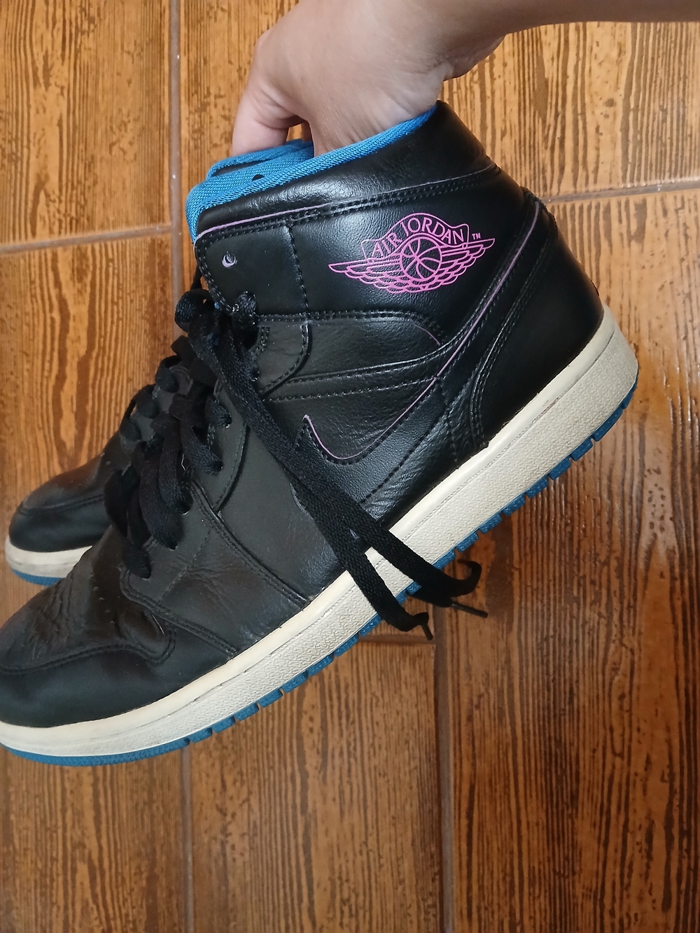 Classic Air Jordan high tops. Black with pink wing logo and blue